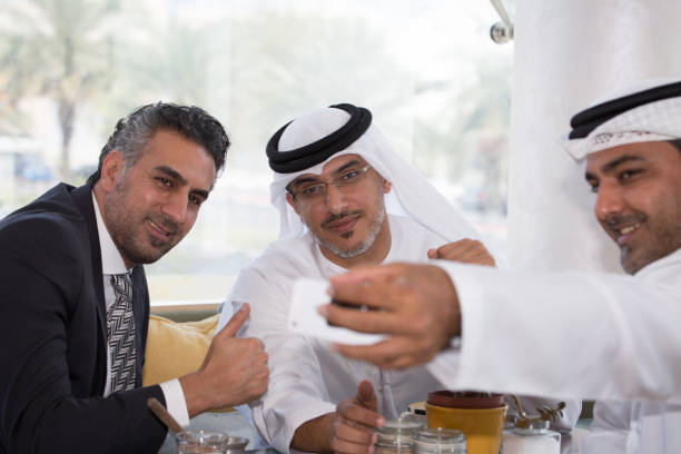 istock Three arab business men doing business 1195874568