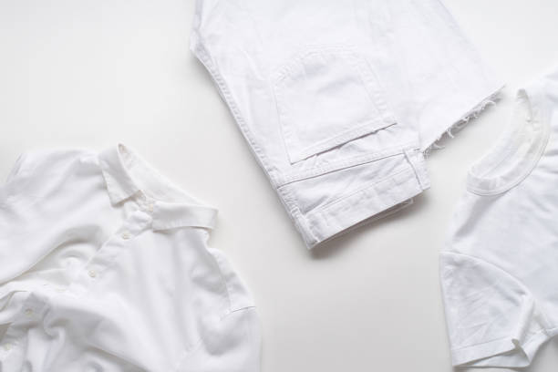 istock White monochromatic flatlay on white background with clothes. Blog design concept 1195876173