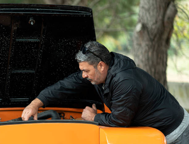 istock man is repairing car 1195876301