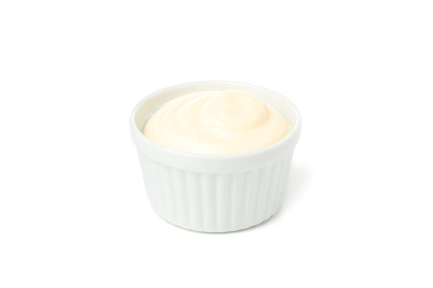 istock Tasty mayonnaise in bowl isolated on white background 1195876314
