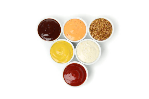 istock Tasty sauces in bowls isolated on white background 1195877208