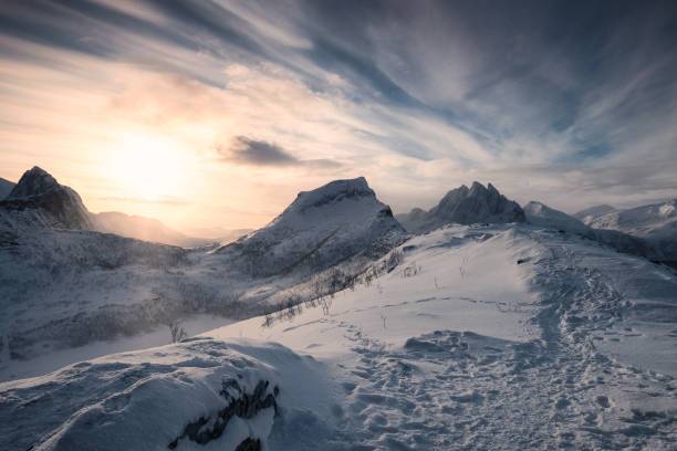 istock Sunrise over snowy mountains on Segla peak at Senja island 1195877341
