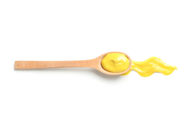 istock Wooden spoon with sauce isolated on white background 1195877841