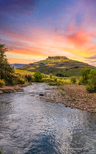 istock Drakensberg valley and a river running through it during sunset 1195882955