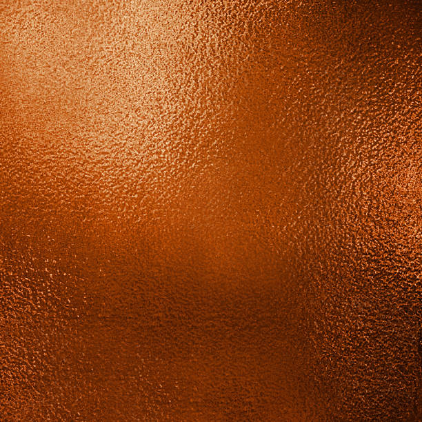 istock Gold foil plate with rough and uneven textured surface.Texture or background 1195884242