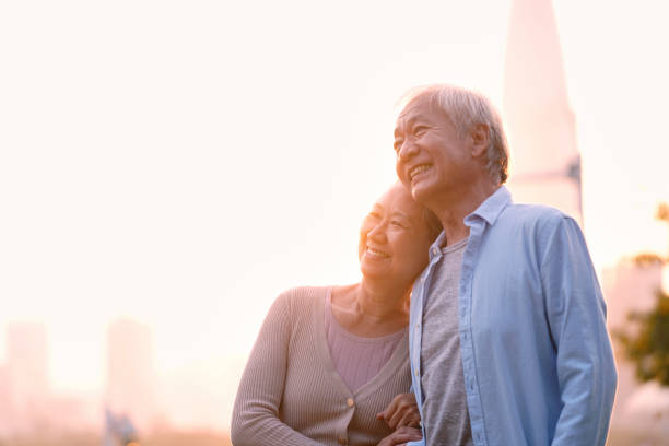 istock senior asian couple enjoying sunset 1195884280