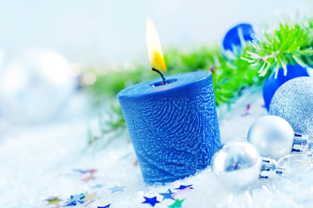 istock candle and christmas decoration 1195884441