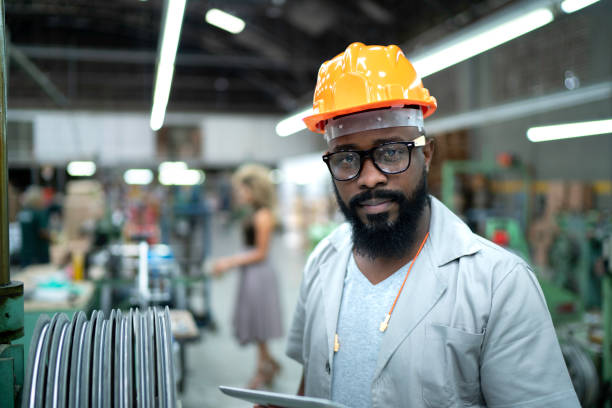 istock Portrait of engineer working with tablet in factory 1195885085