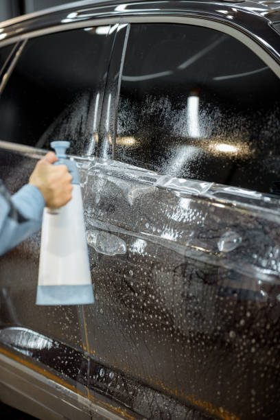 istock Preparing vehicle body before protective film apply 1195886208