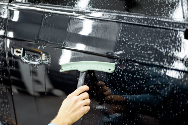 istock Preparing vehicle body before protective film apply 1195886822