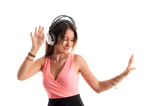 Young girl dancing to the music