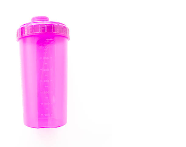 istock Pink protein shaker isolated on the white background, top view. 1195887021