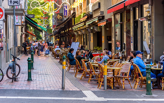 Melbourne, Victoria, Australia, December 21, 2019: Hardware Lane in Melbourne, Australia is a popular tourist area filled with cafes and restaurants featuring al fresco dining.