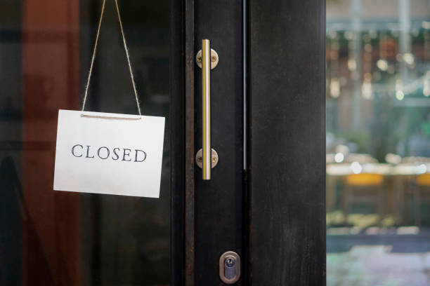 istock closed sign hanging outside a restaurant, store, office or other 1195894730