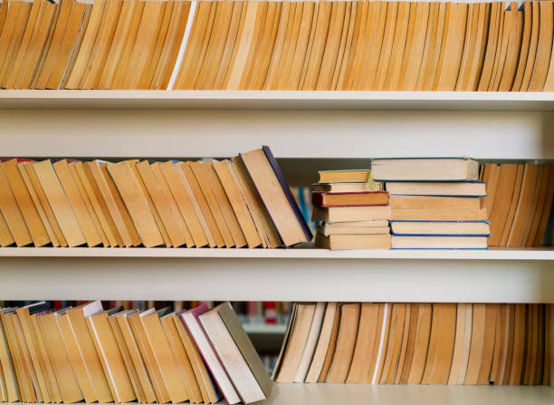 istock Books on the desk in a library 1195899397