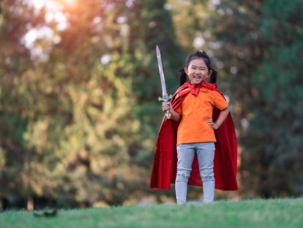 istock Wonder Girl Holding a Sword 1195899492