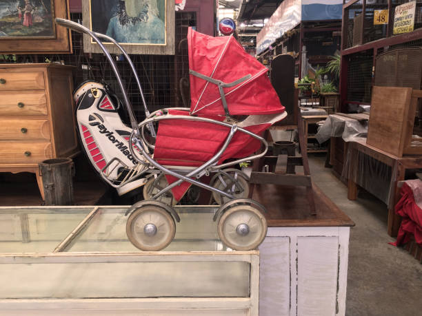 Buenos Aires, Argentina - November 5, 2019: Old-fashioned baby stroller exhibited in Palermo's flea market. In this place anything second hand is for sale, no matter its condition or how old it is