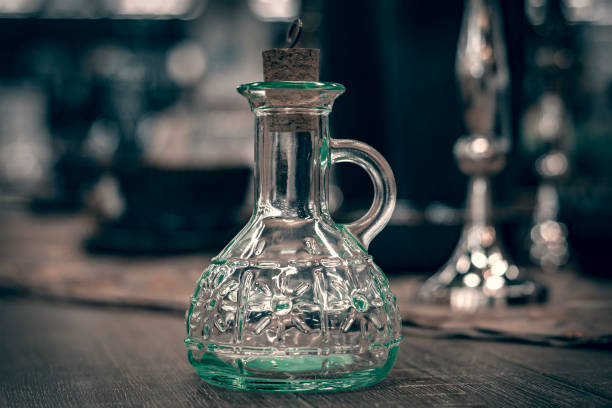 istock Glass transparent carafe with cork on  served table. 1195899851