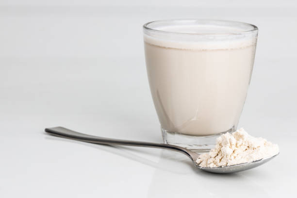 istock Vanilla flavored protein drinks in glass with protein powder scope 1195900973