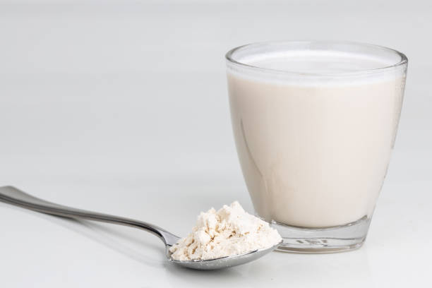 istock Vanilla flavored protein drinks in glass with protein powder scope 1195900977
