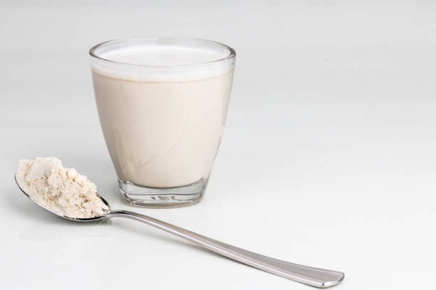 istock Vanilla flavored protein drinks in glass with protein powder scope 1195900985