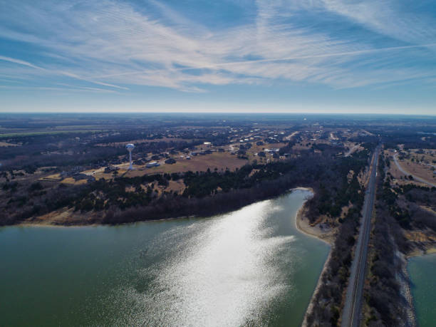 istock Train track over water and water tower 1195901589