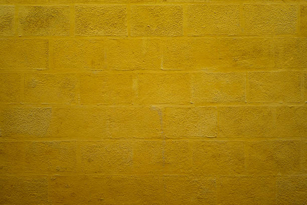 istock Texture of old yellow concrete wall for background 1195902129