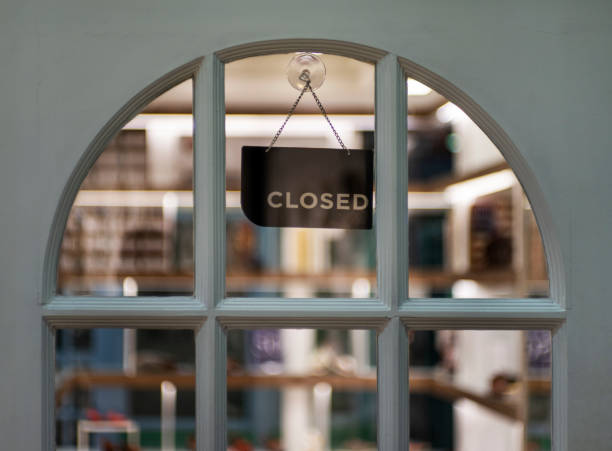 istock closed sign hanging outside a restaurant, store, office or other 1195902140