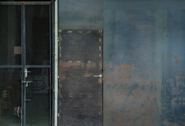 istock old and rusty door chipped in wall 1195902164