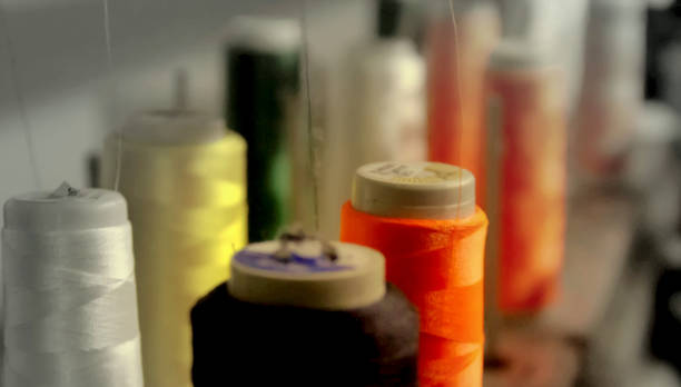 istock Colorful yarn on spool, yarn on tube, cotton, wool, linen thread. 1195907837