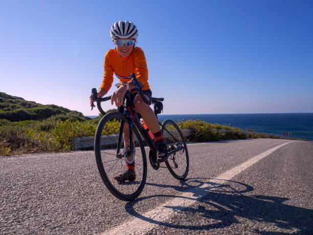 istock woman cycling road bicycle 1195911396