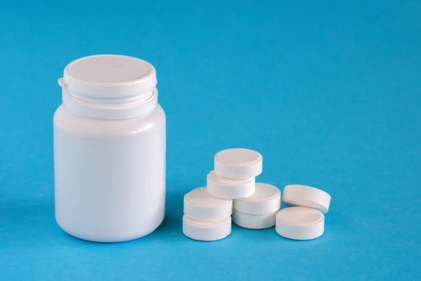 istock Medicine. Pills near the box on a blue background, copy space, assorted pharmaceutical 1195913308