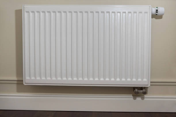 istock Heating Radiator, White radiator in an apartment 1195913417