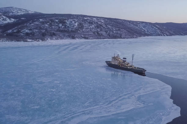 istock Ice-enpalled naldo, ice breaking ship. 1195915395