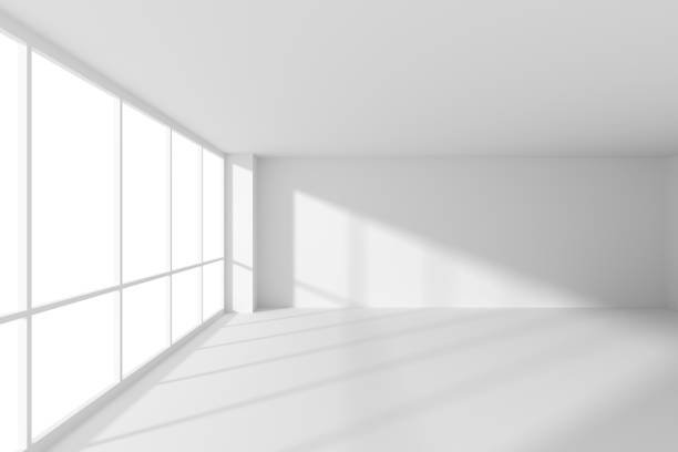 istock Empty white office business room with sunlight from large windows 1195915489