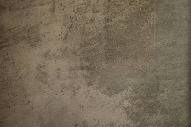 istock Old rusty grungy vintage brown concrete wall texture background pattern. This old concrete wall is worn 1195918890