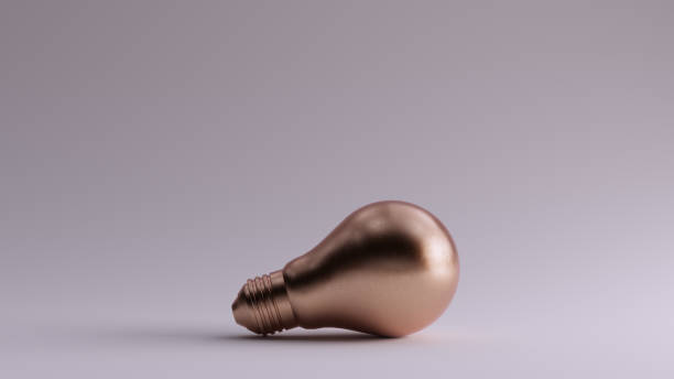 istock Bronze Light Bulb Resting on the Ground 1195920990