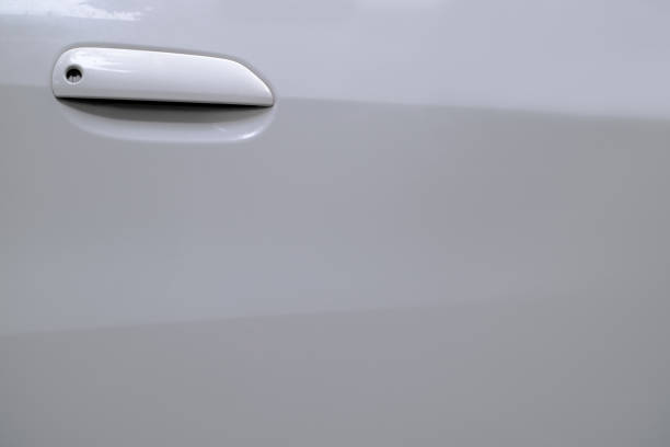 istock White car handle and blank space on door for copy 1195921833