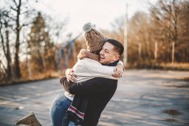 Young and happy couple having fun in nature