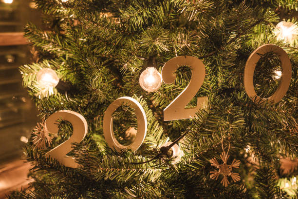 istock gold christmas lights on the tree 1195928057