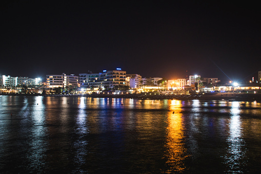 Puerto Andratx, Spain -April 14, 2024: View at the Puerto Andratx harbor at a boat dock at the night time. The harbor in Puerto Andratx, Mallorca, is renowned for its affluent international visitors, whether tourists or residents, especially during sunset and for its pub nightlife.