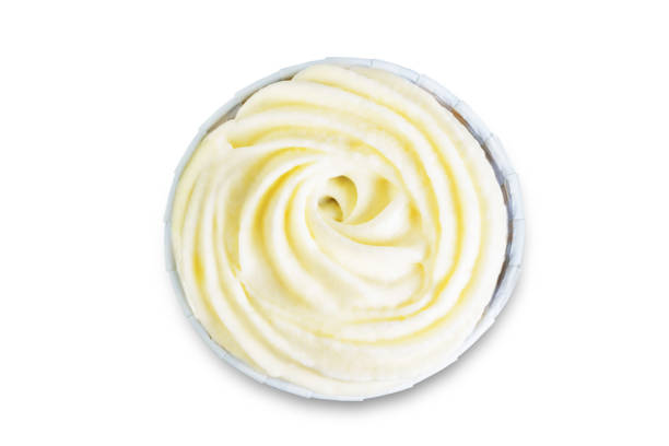 istock Chocolate cupcakes with cream cheese frosting on a white isolated background 1195932738