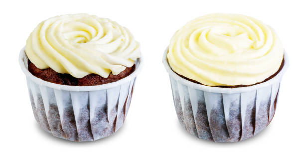 istock Chocolate cupcakes with cream cheese frosting on a white isolated background 1195932752