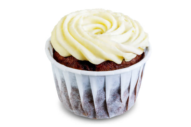 istock Chocolate cupcakes with cream cheese frosting on a white isolated background 1195932769