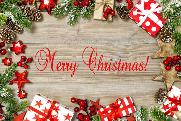 istock Merry Christmas Pine tree branches gift boxes red ornaments 1195937386