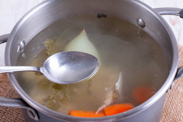istock Fresh fish broth. Fish soup with ingredients and spices for cooking 1195937484