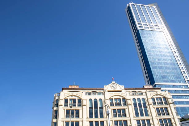 istock Skyscraper and two buildings belonging to classic old architecture next to it. 1195938121