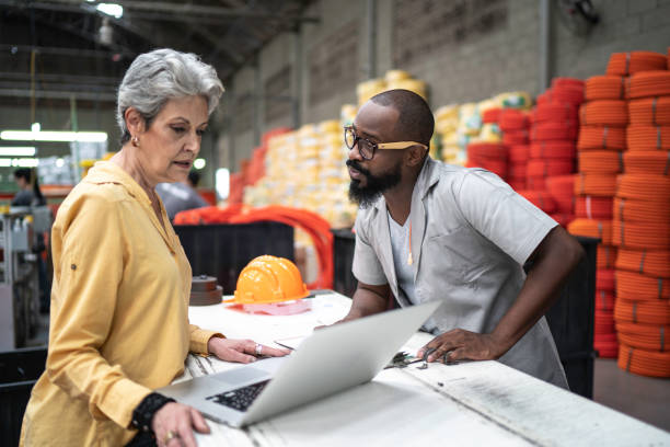 istock Colleagues working in industry and using laptop 1195938223