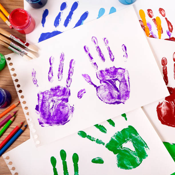 istock Handprints and art equipment 1195938317