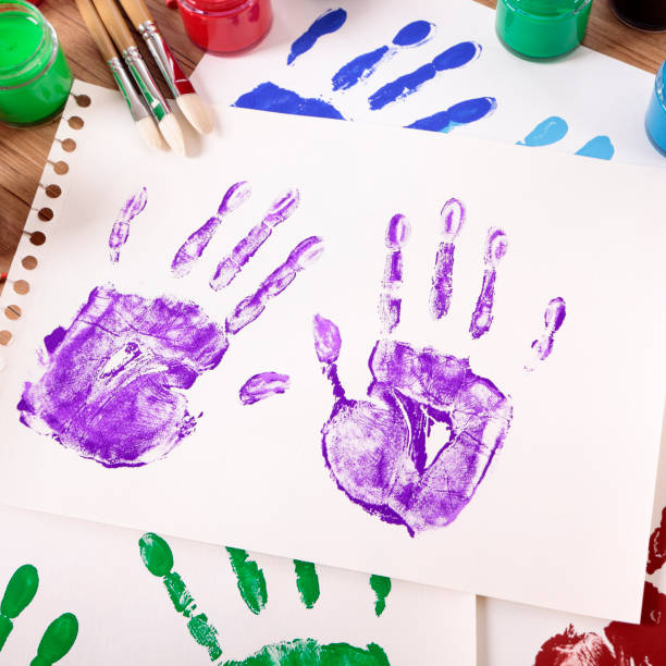 istock Handprints and art equipment 1195939692